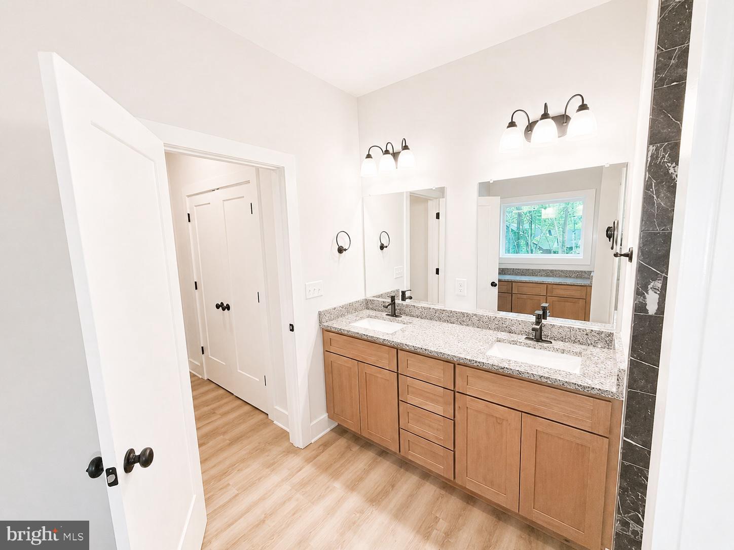 1321 Fulton Road Hedgesville, WV 25427 - Photo 15 of 36 a bathroom with a granite countertop sink mirror and a bathtub
