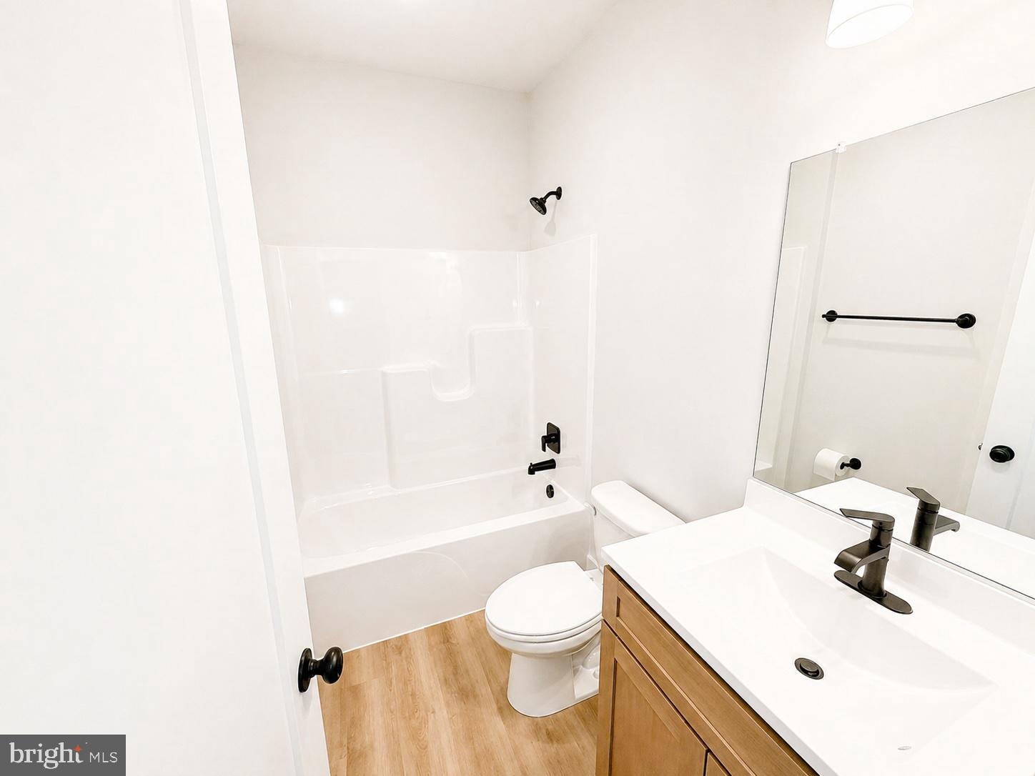 1321 Fulton Road Hedgesville, WV 25427 - Photo 21 of 36 a bathroom with a sink a toilet and shower