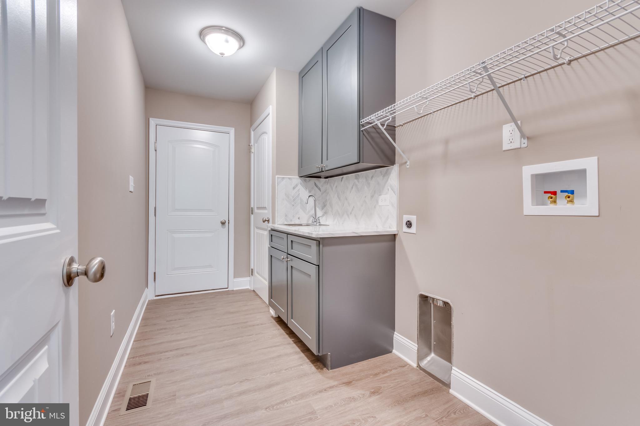 25 Fulton Road Hedgesville, WV 25427 - Photo 23 of 35 a bathroom with a sink and a mirror