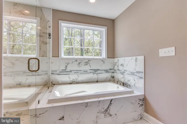 a bathroom with a bathtub and a sink