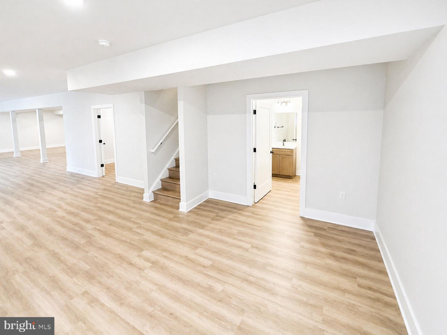 1321 Fulton Road Hedgesville, WV 25427 - Photo 27 of 36 a view of a room with wooden floor and white walls