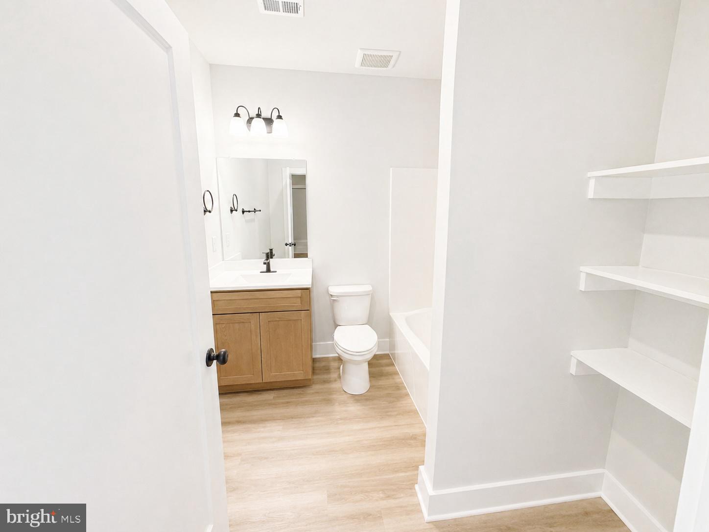 1321 Fulton Road Hedgesville, WV 25427 - Photo 28 of 36 a bathroom with a sink mirror and a toilet