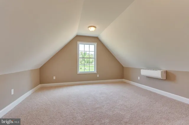 an empty room with windows and entrance