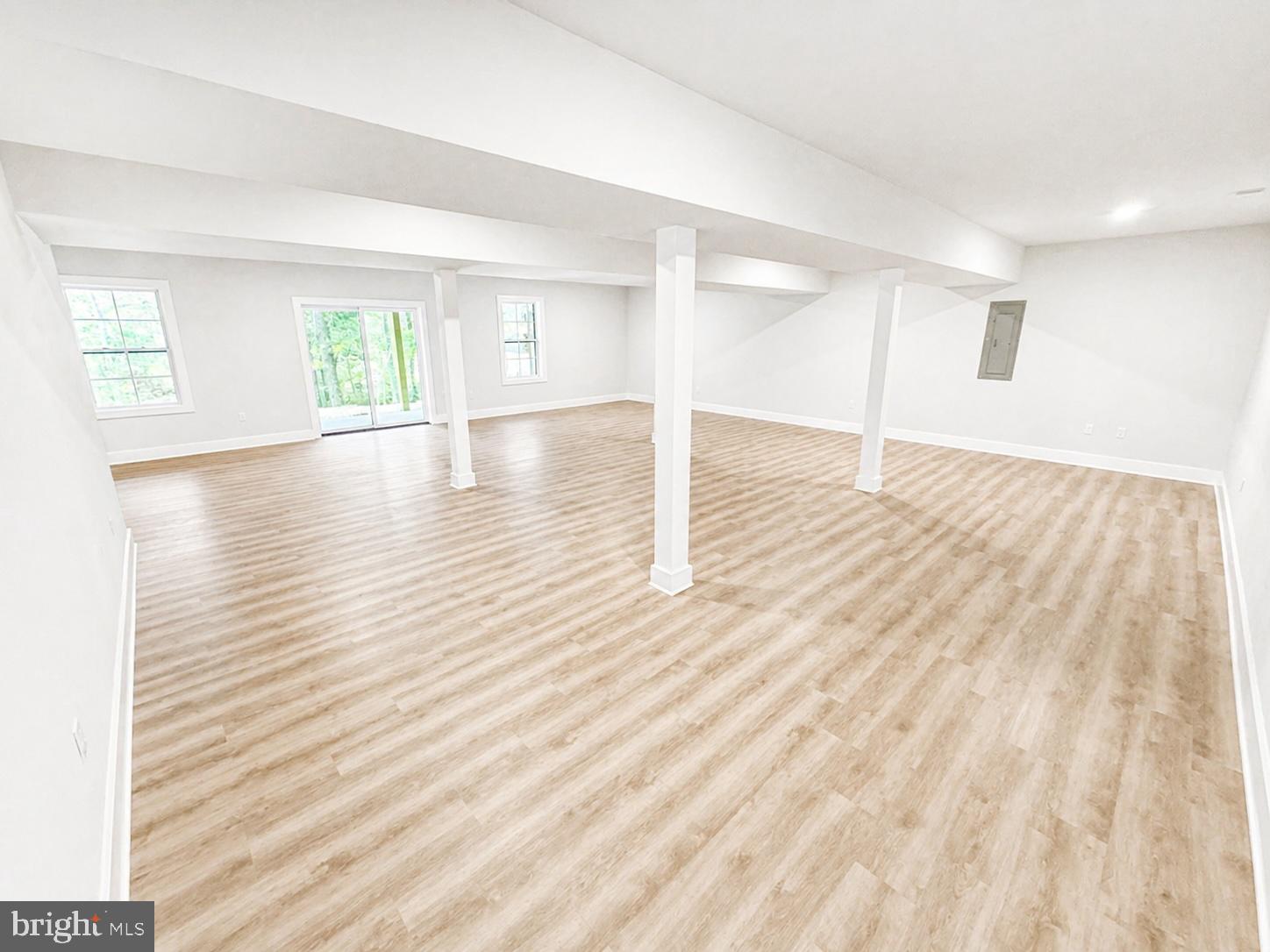 1321 Fulton Road Hedgesville, WV 25427 - Photo 30 of 36 a view of empty room with wooden floor and fan
