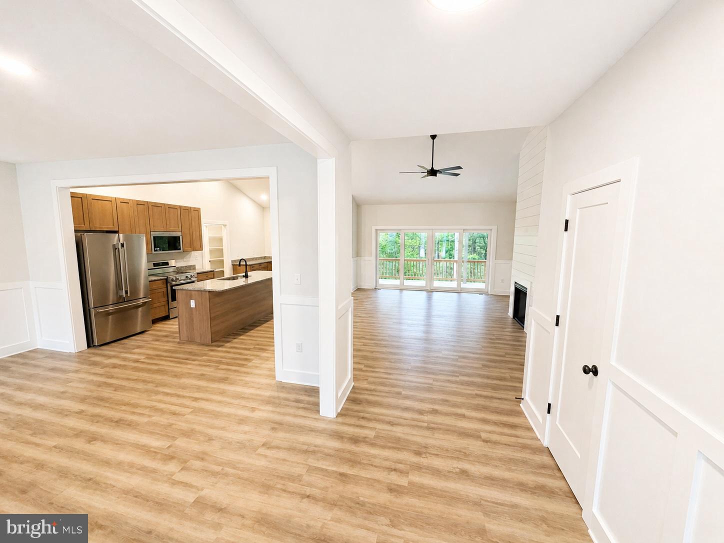 1321 Fulton Road Hedgesville, WV 25427 - Photo 4 of 36 a view of a living room with wooden floor and a large window