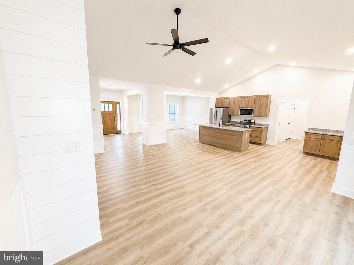 1321 Fulton Road Hedgesville, WV 25427 - Photo 8 of 36 a view of living room with kitchen island furniture and a ceiling fan