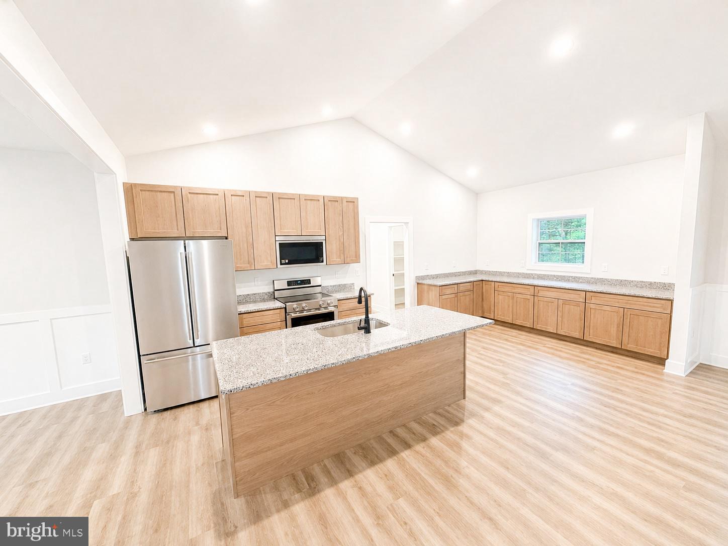 1321 Fulton Road Hedgesville, WV 25427 - Photo 10 of 36 a kitchen with granite countertop a refrigerator and a sink
