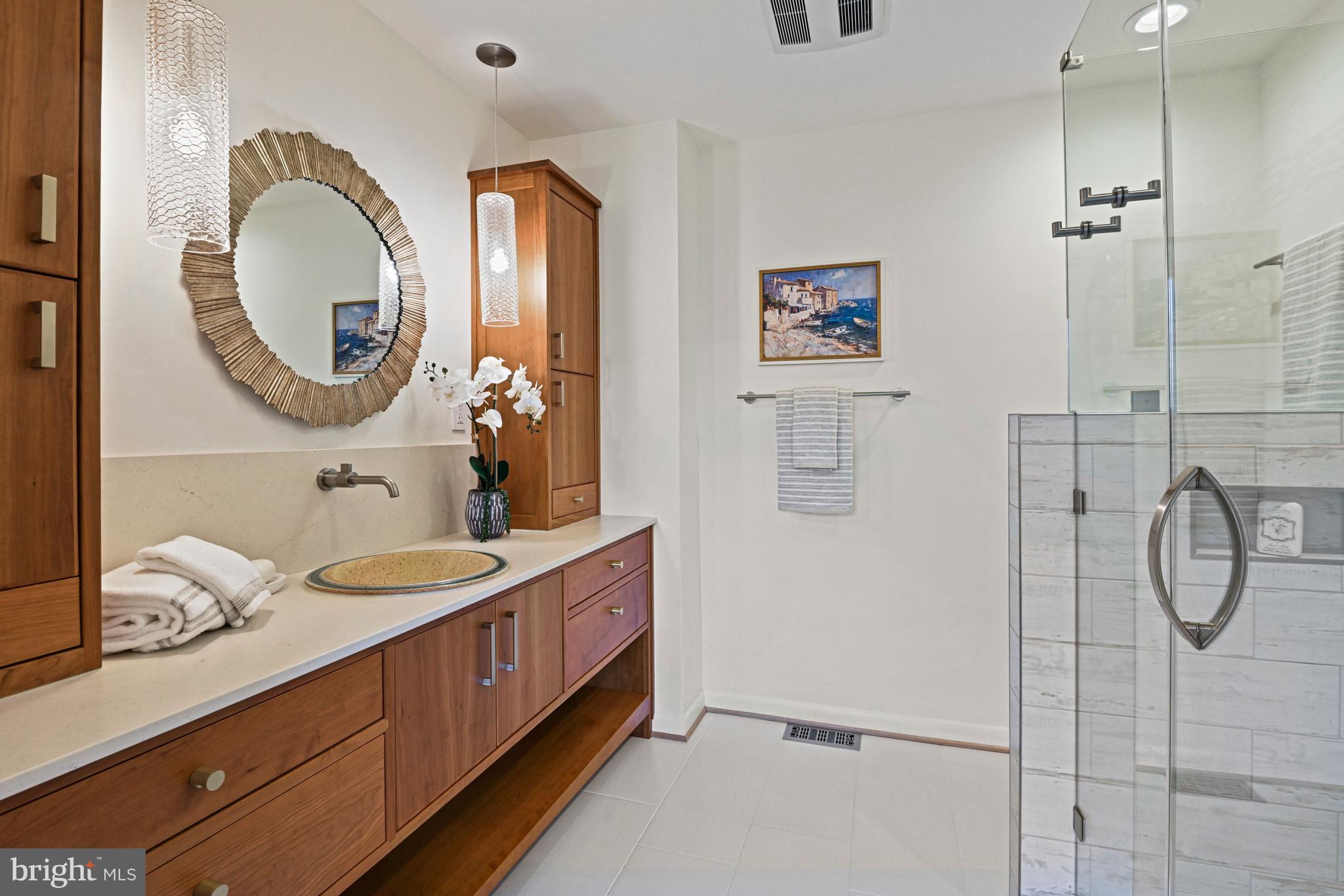 2029 Chadds Ford Drive Reston, VA 20191 - Photo 2 of 55 a bathroom with a mirror double vanity sink and a mirror