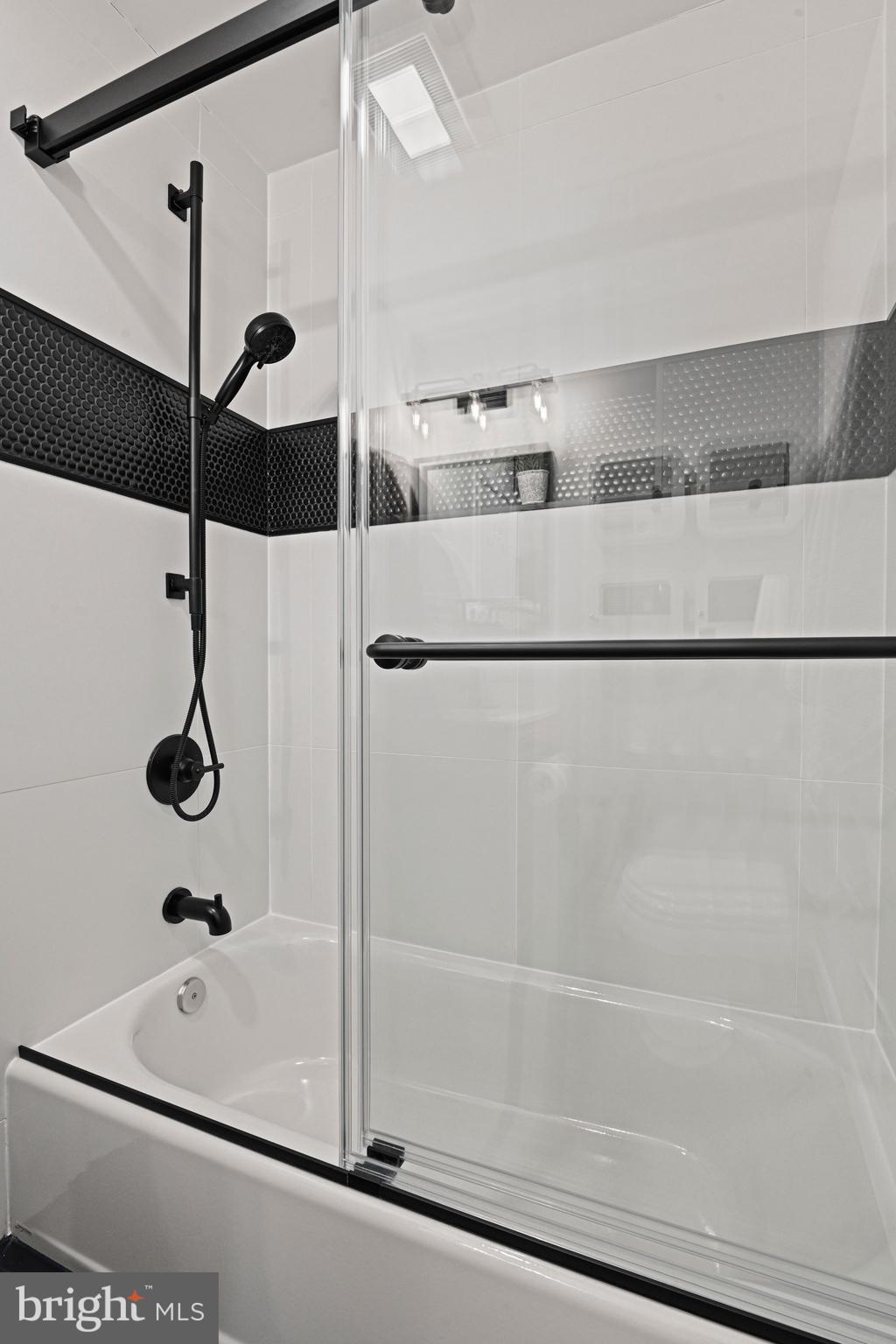 2029 Chadds Ford Drive Reston, VA 20191 - Photo 31 of 55 a bathroom with a bathtub and a shower