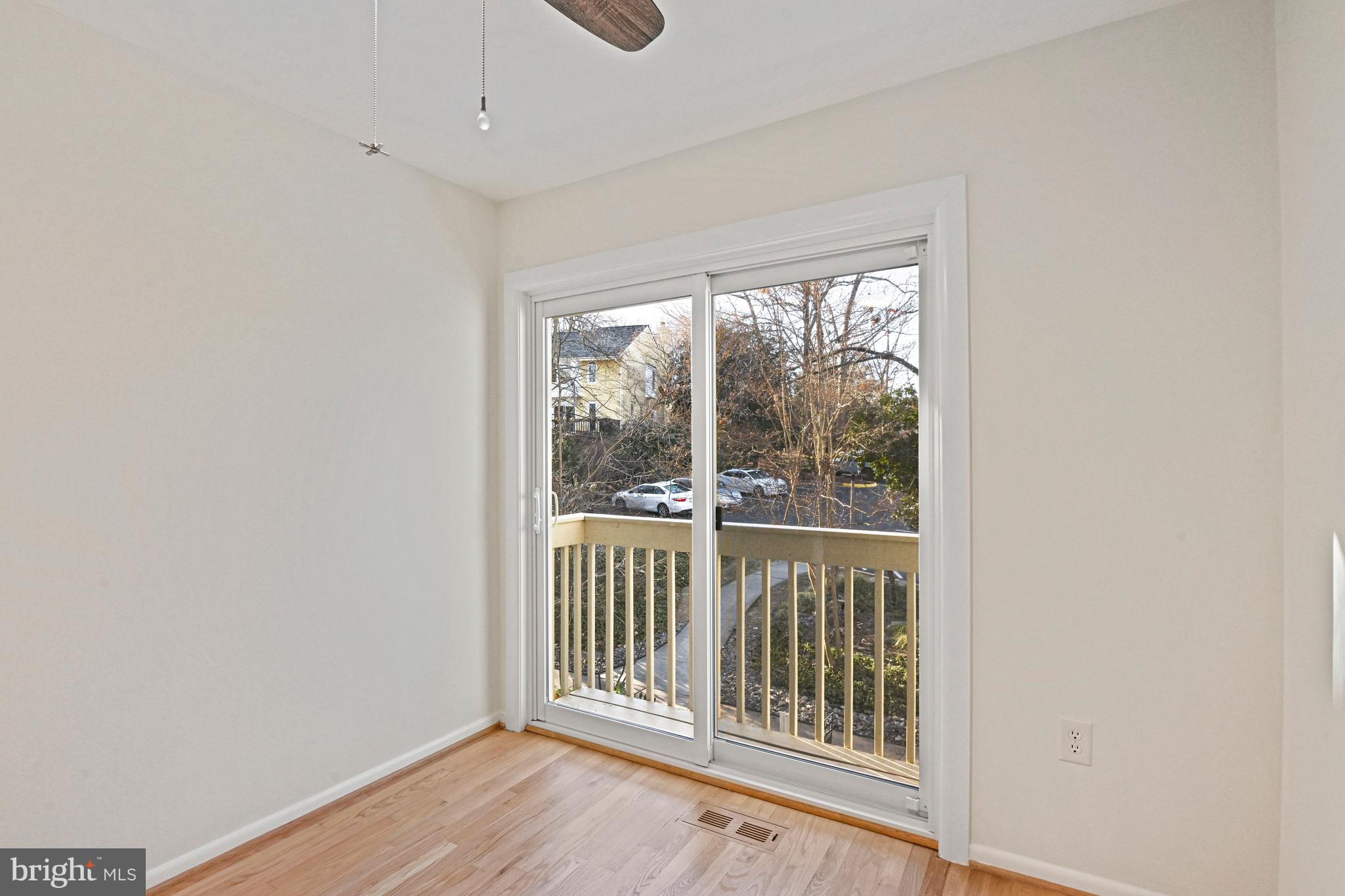 2029 Chadds Ford Drive Reston, VA 20191 - Photo 34 of 55 an empty room with wooden floor and windows