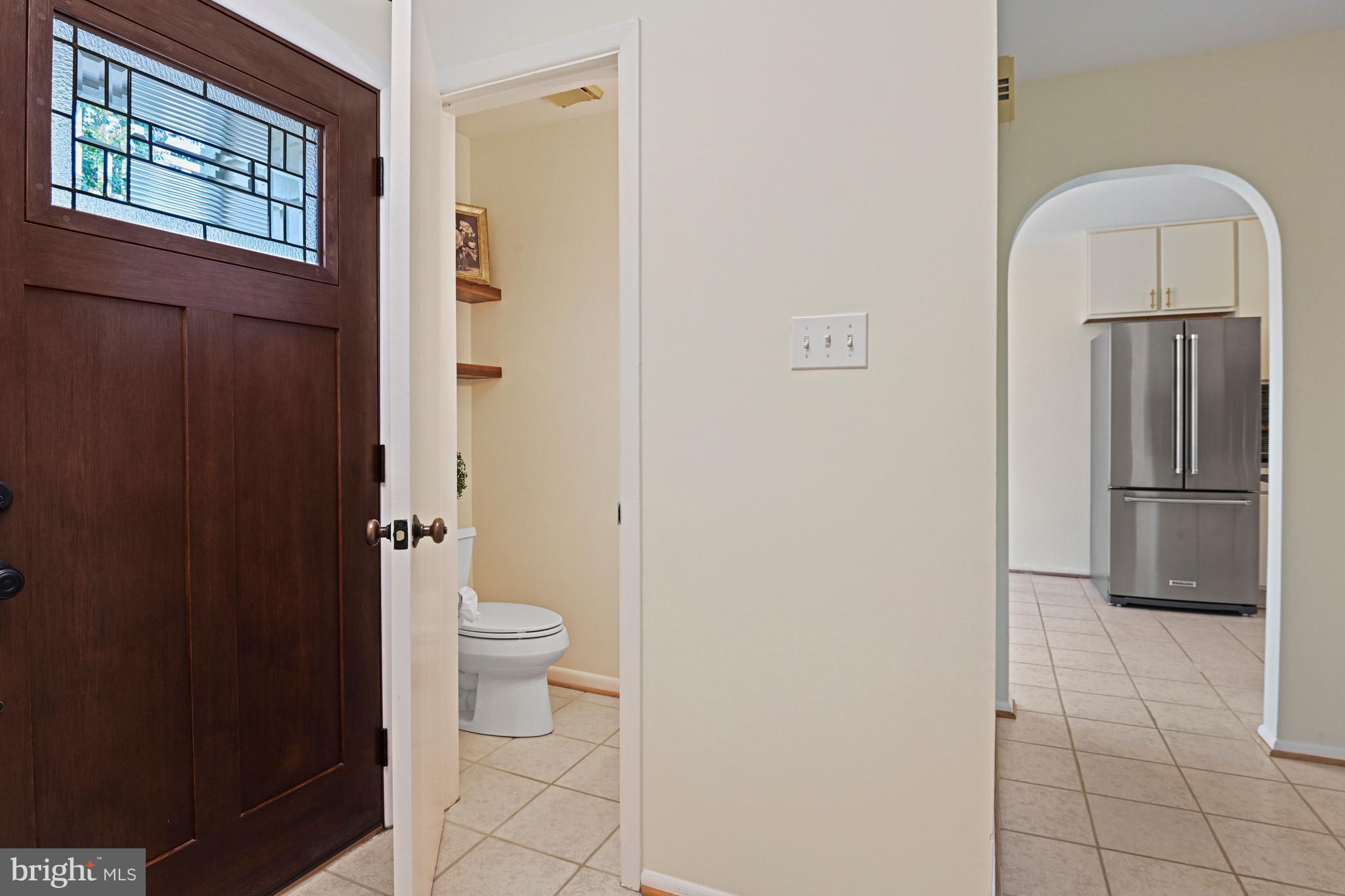 2029 Chadds Ford Drive Reston, VA 20191 - Photo 7 of 55 a bathroom with a granite countertop toilet and a sink