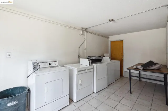 a view of storage and utility room with washer and dryer