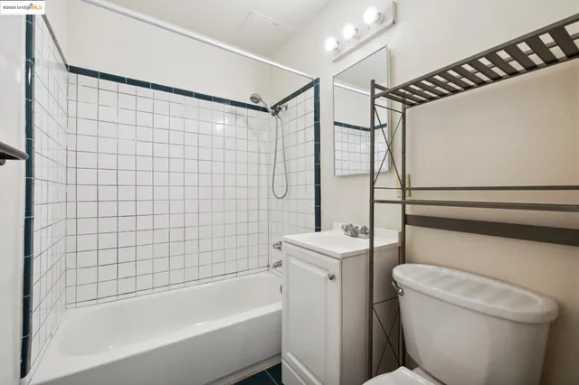 a bathroom with a shower a toilet and a bathtub