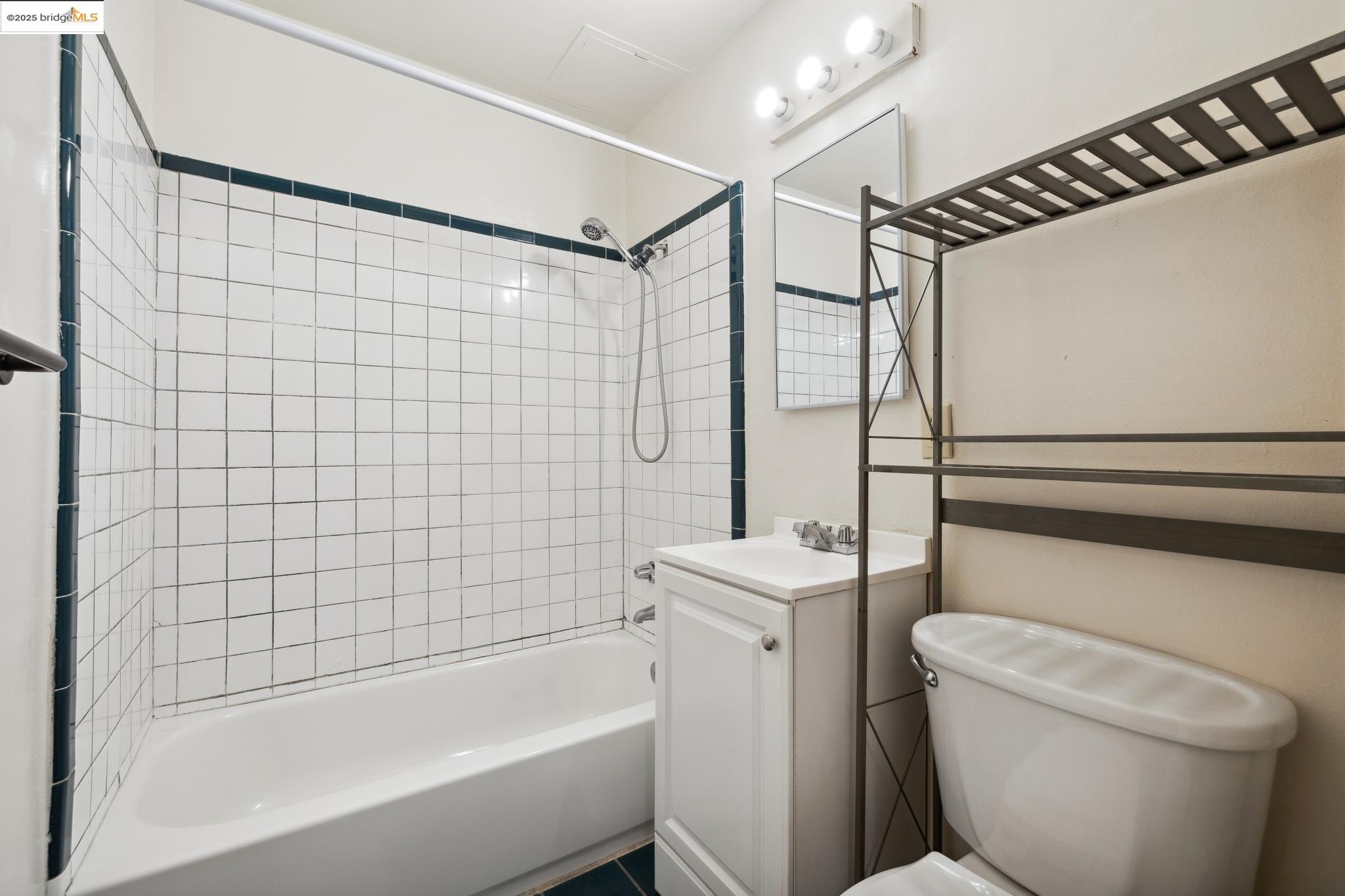 1612 Parker Street Berkeley, CA 94703 - Photo 7 of 16 a bathroom with a shower a toilet and a bathtub