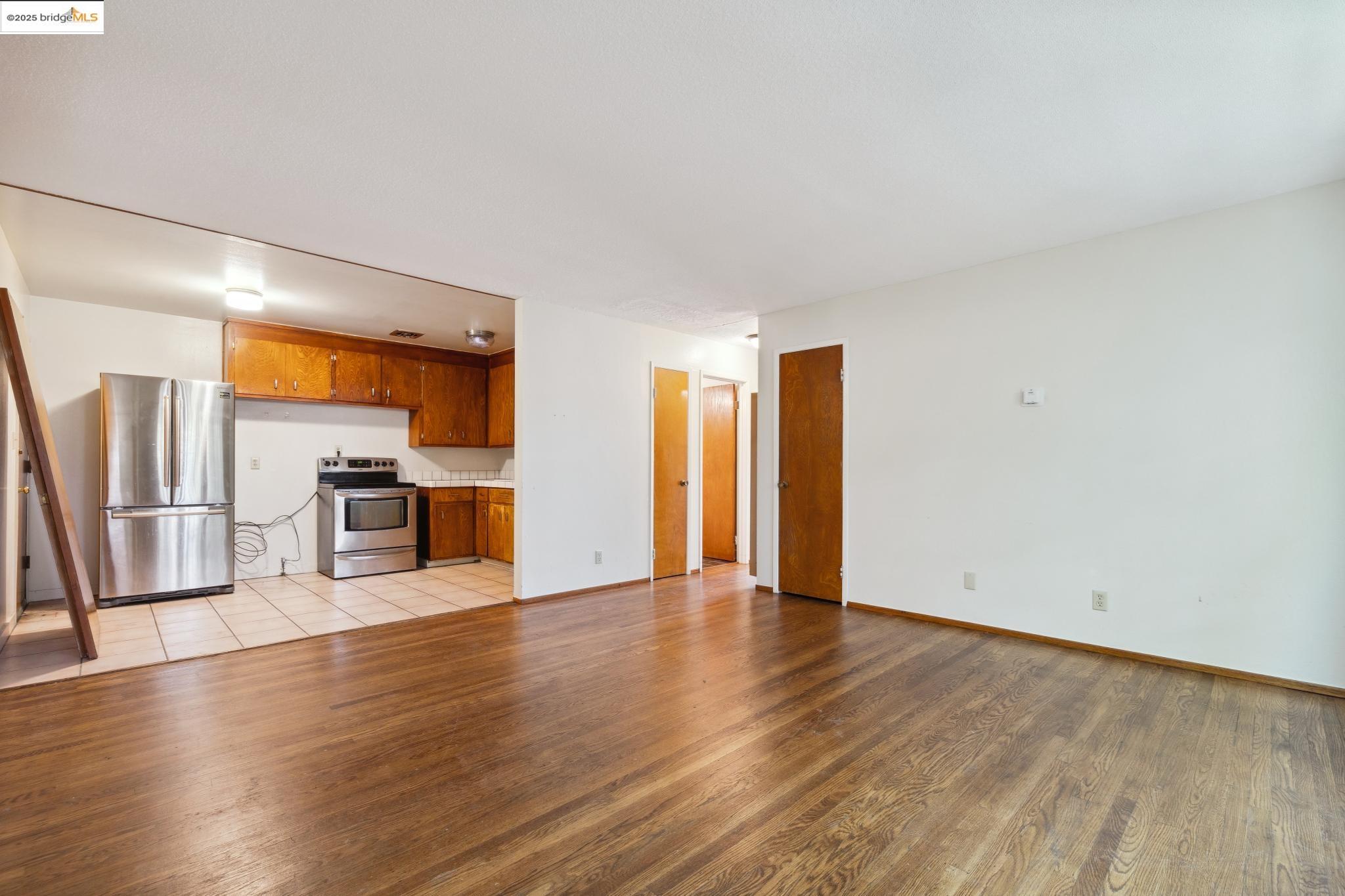 1612 Parker Street Berkeley, CA 94703 - Photo 8 of 16 a view of a kitchen with a sink stove cabinets and empty room