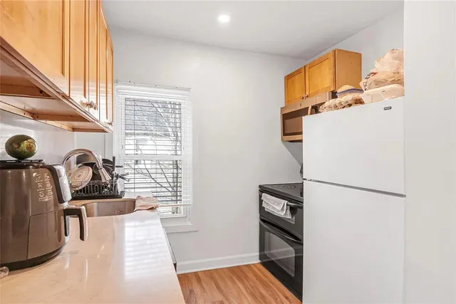 a room that has a couch and a stove in it