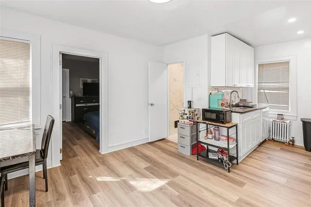 a view of a livingroom with furniture and hardwood floor