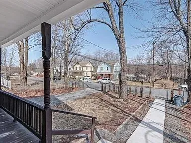 a view of a porch with a bench in patio