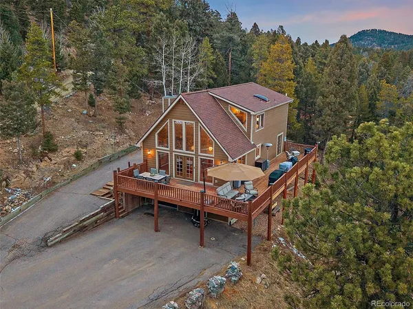 a roof view of a house with a yard
