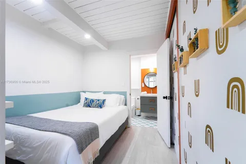 a bathroom with a sink a mirror a toilet and a sink