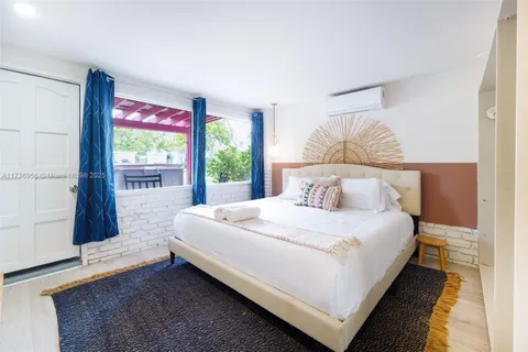 a bathroom with a sink a mirror a vanity and a shower