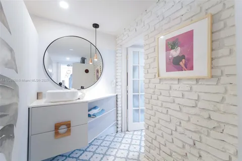 a bathroom with a toilet and a shower curtain
