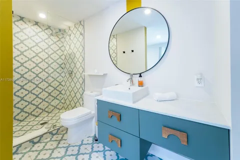 a bedroom with a bed and a walk in closet