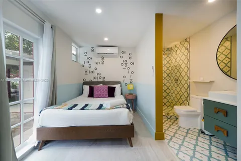 an aerial view of a house with a yard swimming pool outdoor seating and yard