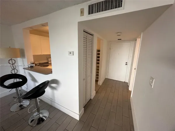 a view of a hardwood floor and staircase