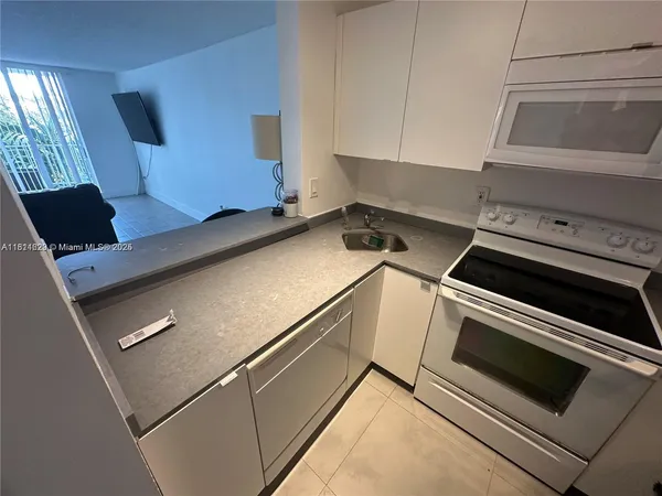 a bathroom with a sink mirror and vanity