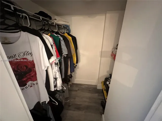 a kitchen with a refrigerator and a sink