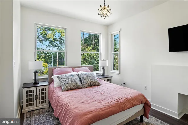 a bedroom with a bed and a table in it