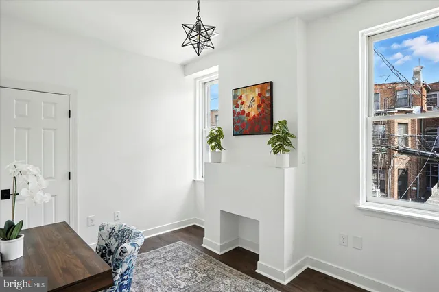 a view of bedroom with furniture and wooden floor