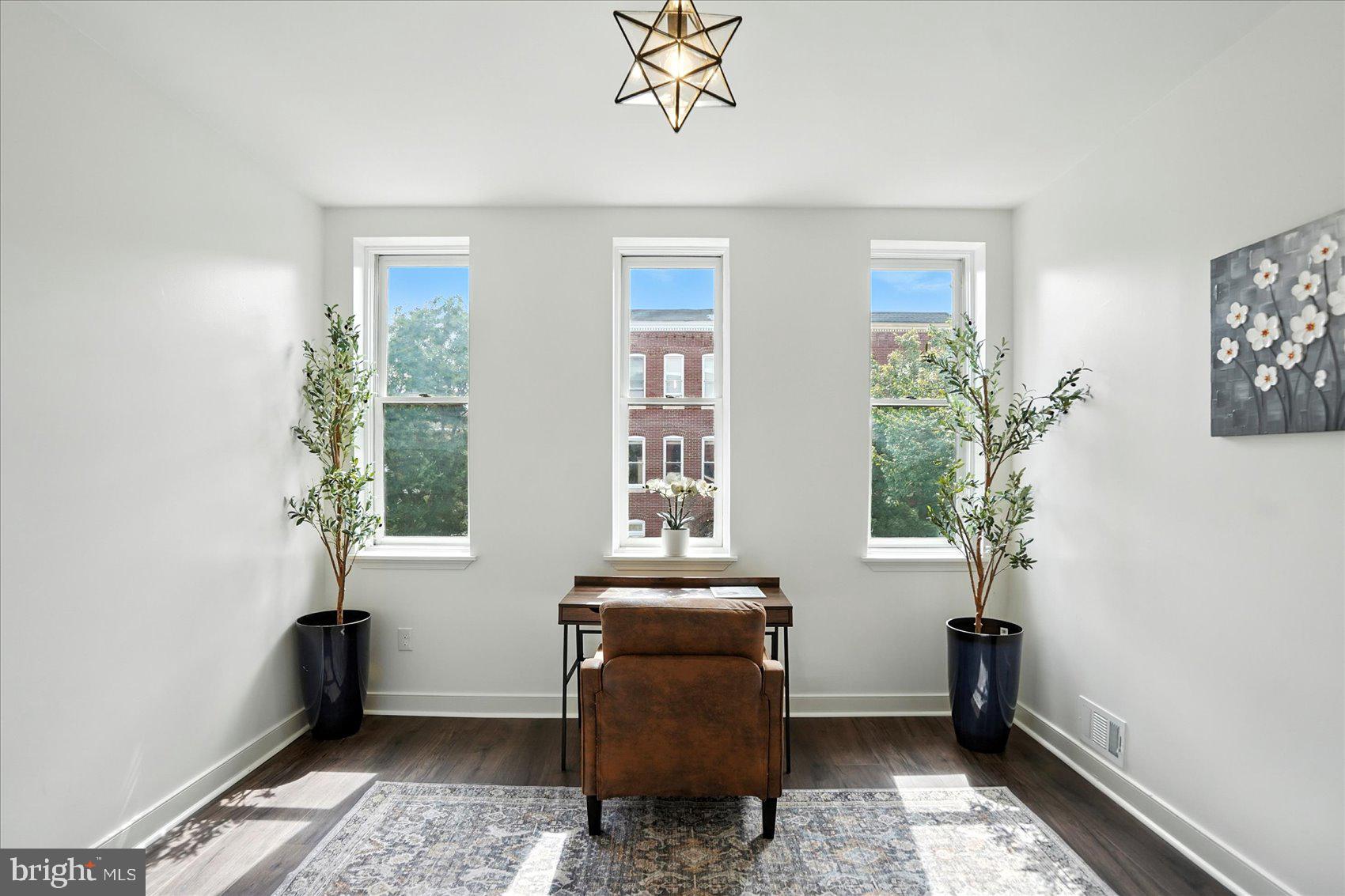 416 Mosher Street Baltimore, MD 21217 - Photo 25 of 38 a living room with furniture and a window