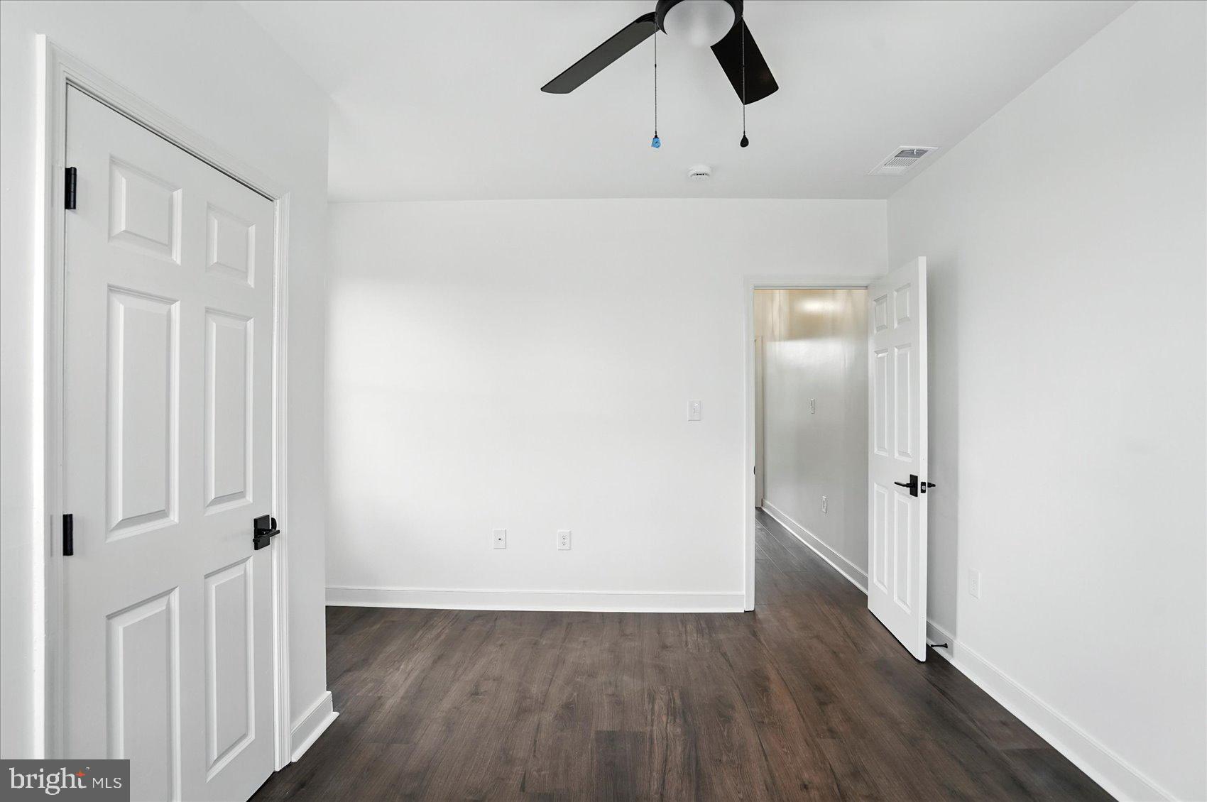 416 Mosher Street Baltimore, MD 21217 - Photo 31 of 38 wooden floor in an empty room