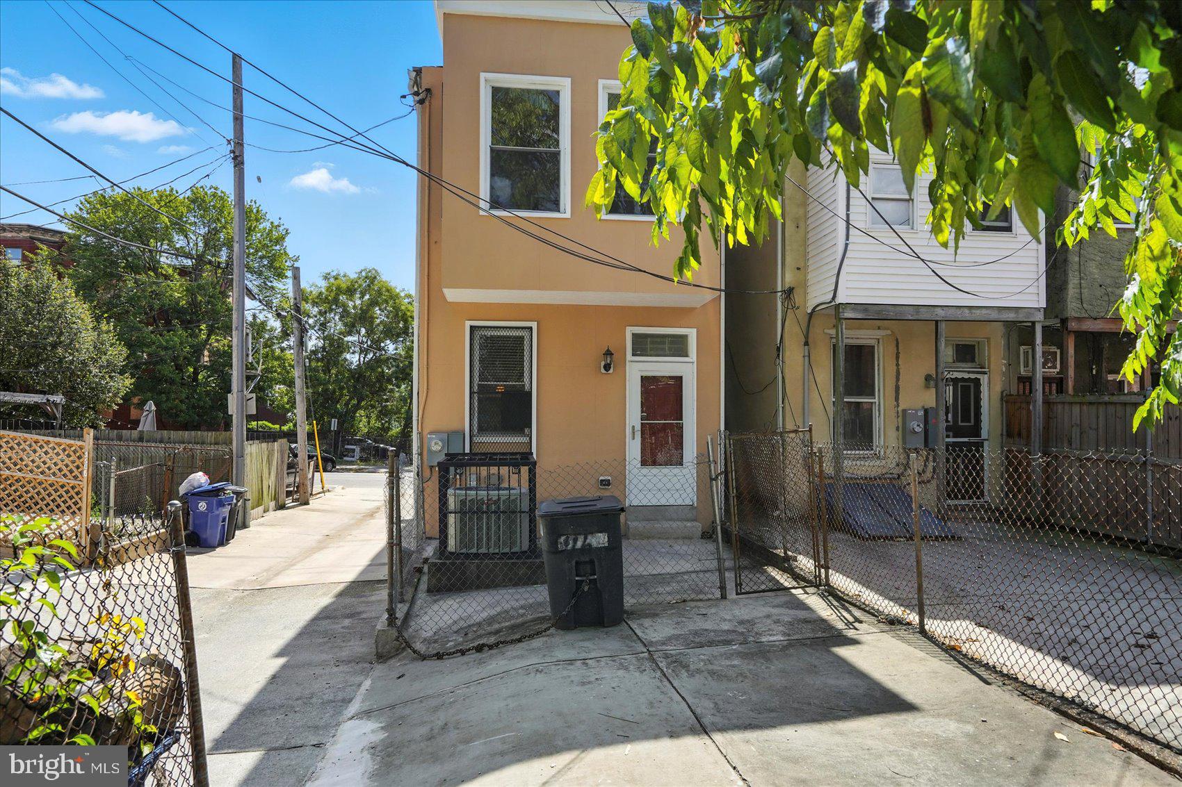 416 Mosher Street Baltimore, MD 21217 - Photo 37 of 38 a view of a patio with table and chairs and potted plants