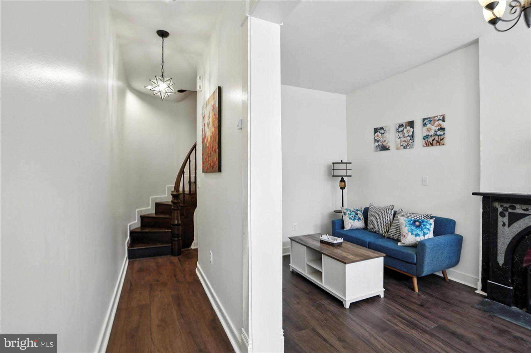 416 Mosher Street Baltimore, MD 21217 - Photo 7 of 38 a living room with furniture and a wooden floor
