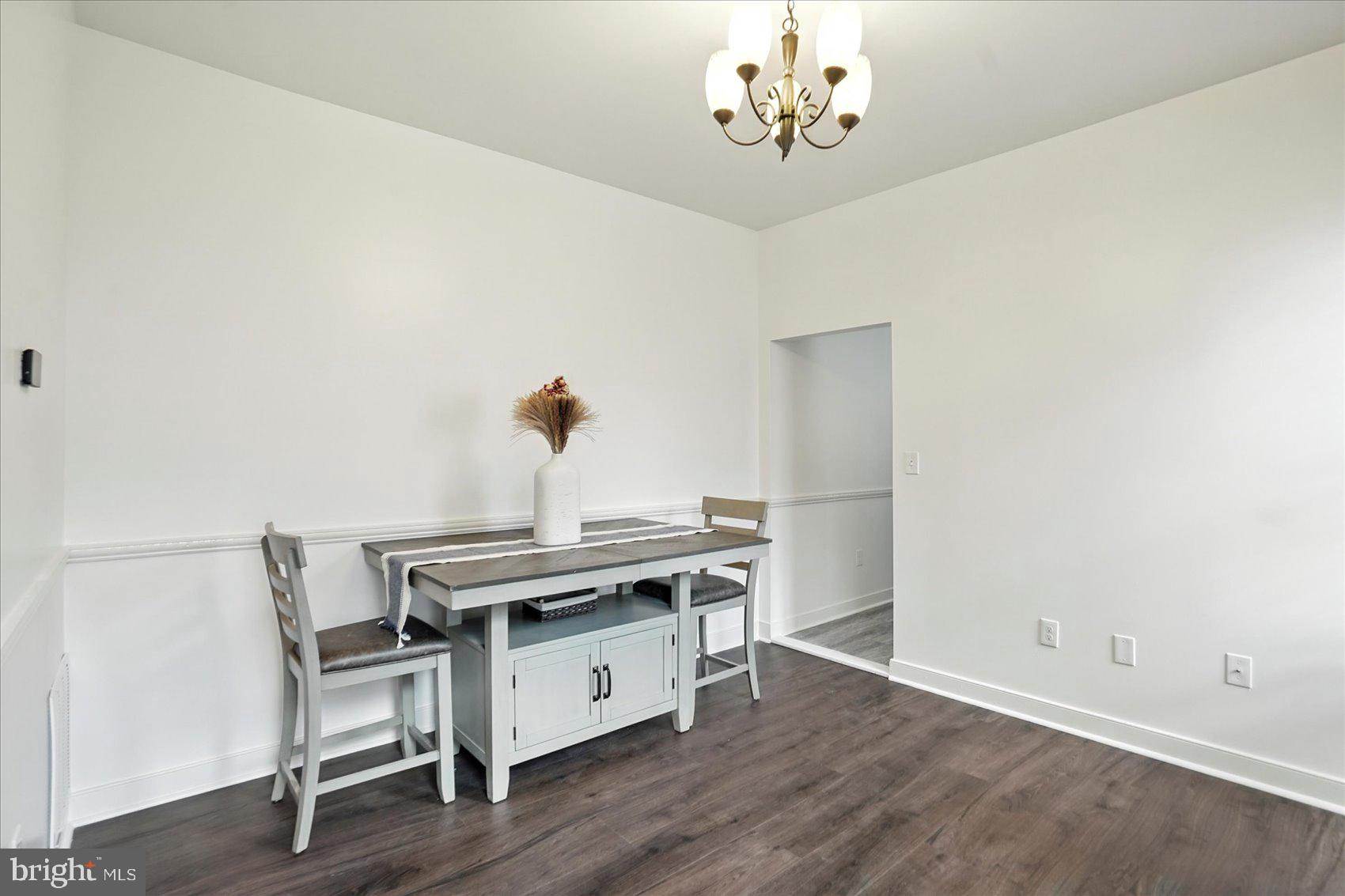 416 Mosher Street Baltimore, MD 21217 - Photo 9 of 38 a view of a dining room with furniture and wooden floor