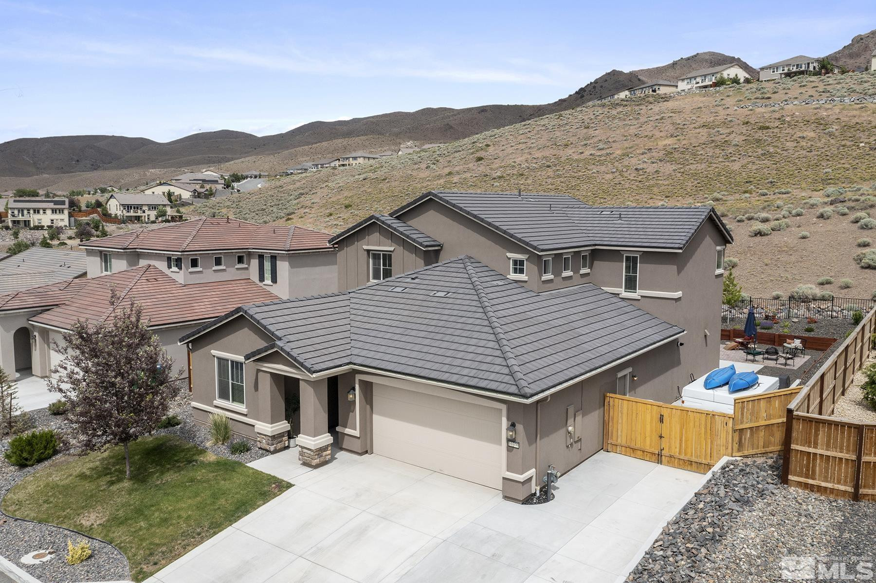 10370 Gold Mine Drive Reno, NV 89521 - Photo 1 of 31 a aerial view of a house next to a yard