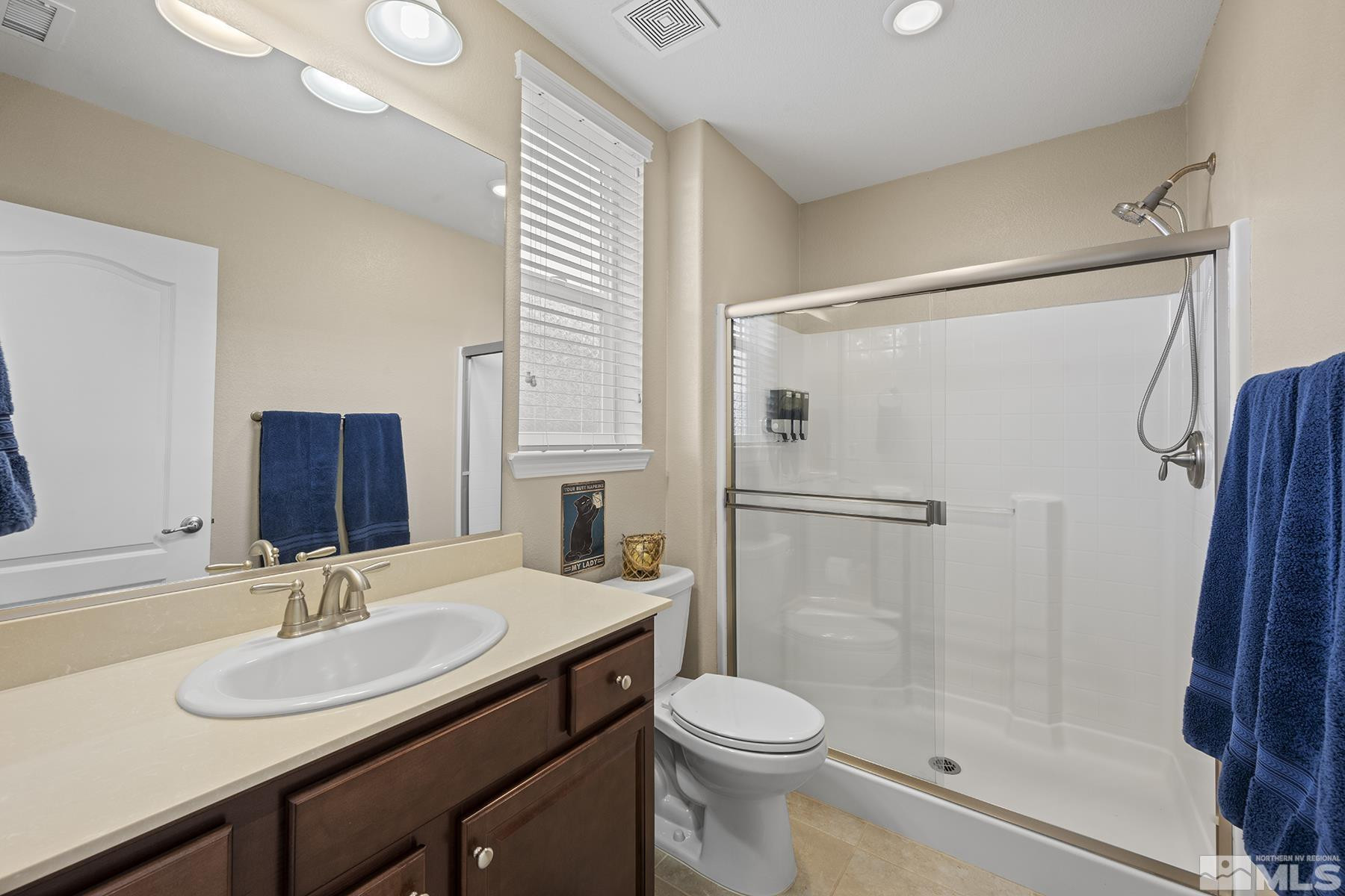 10370 Gold Mine Drive Reno, NV 89521 - Photo 15 of 31 a bathroom with a sink toilet and shower