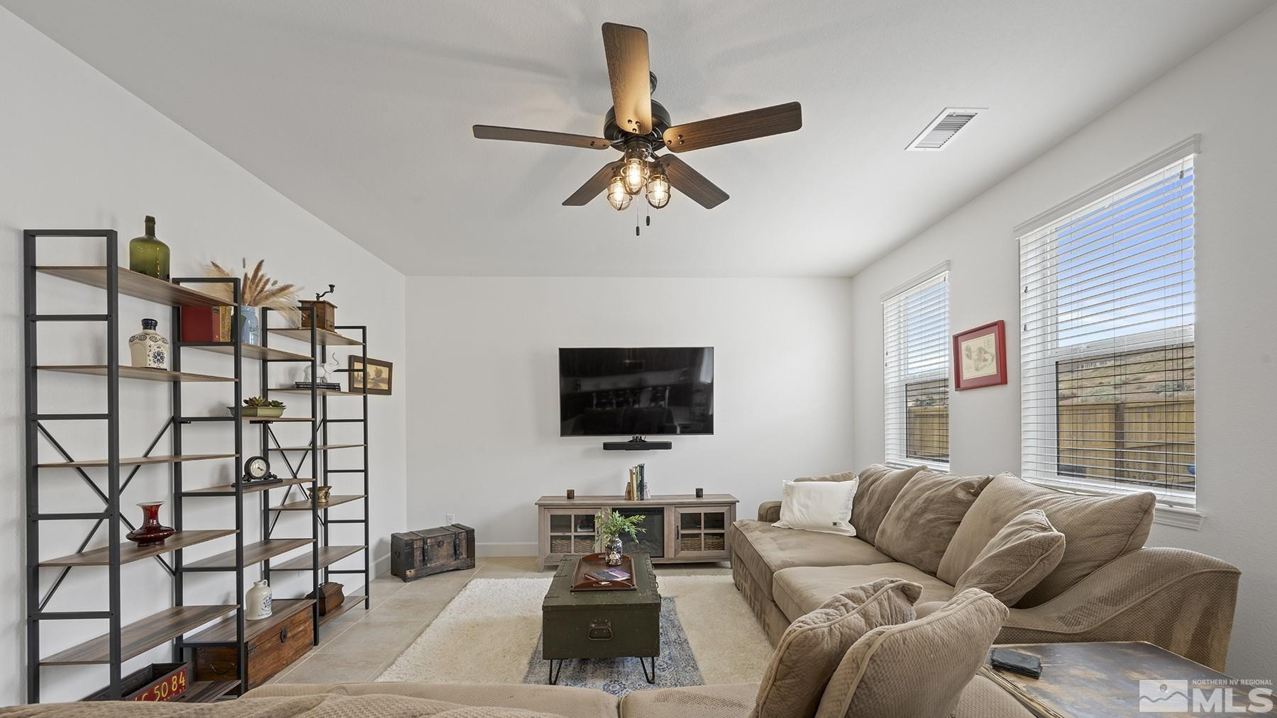 10370 Gold Mine Drive Reno, NV 89521 - Photo 7 of 31 a living room with furniture and a flat screen tv