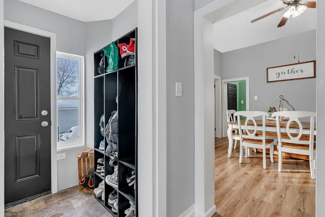 a view of a livingroom with furniture and hardwood floor