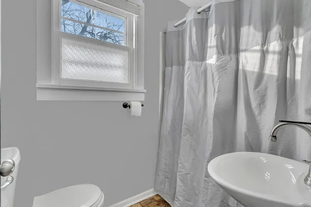 a bathroom with a toilet and a sink
