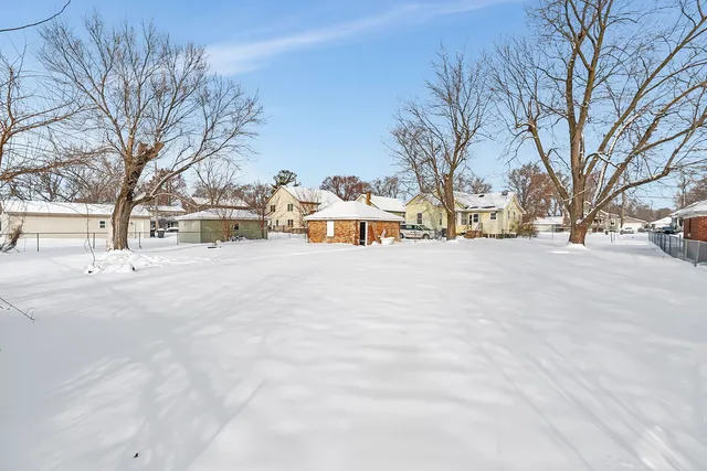 a view of street with a snow on the road