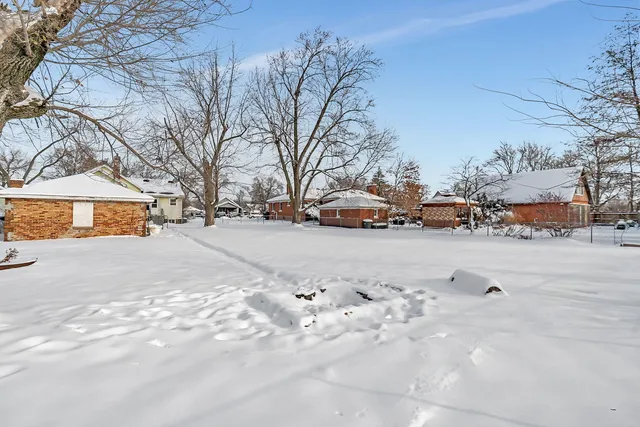 a view of a house with a road