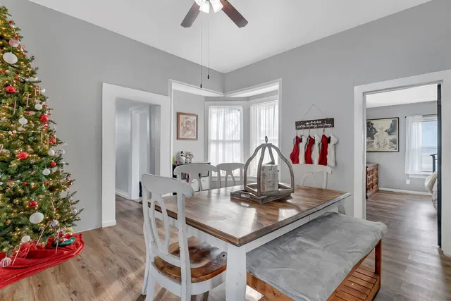 a view of a dining room with furniture and wooden floor