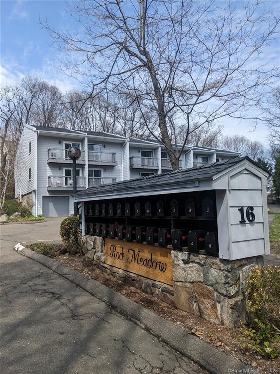 16 Rockmeadow Road, Unit M Norwalk, CT 06850 - Photo 1 of 1 front view of a house with a yard