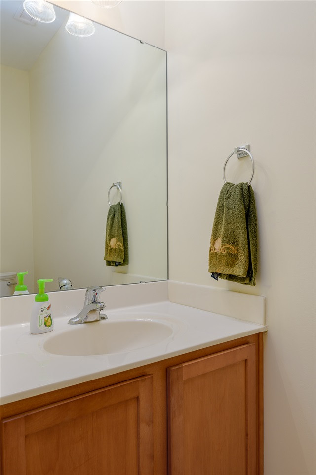 3525 Oneonta Avenue Raleigh, NC 27604 - Photo 12 of 22 a bathroom with a sink and a mirror