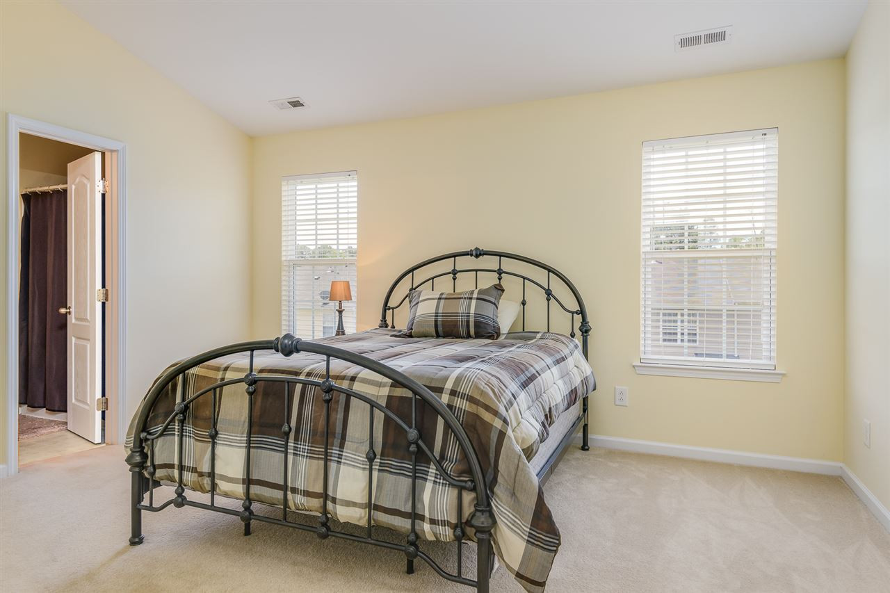 3525 Oneonta Avenue Raleigh, NC 27604 - Photo 14 of 22 a bedroom with a bed and a window