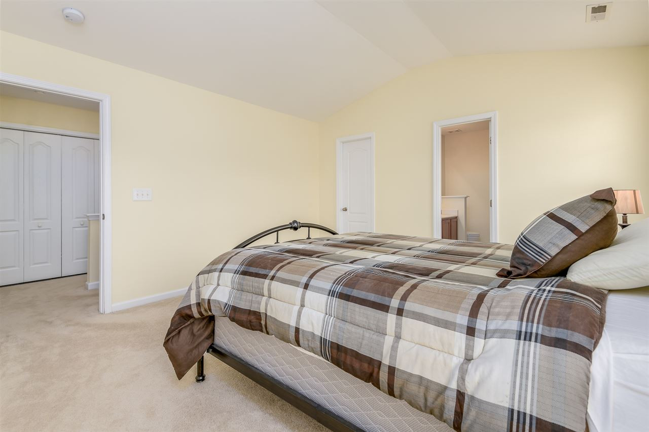 3525 Oneonta Avenue Raleigh, NC 27604 - Photo 15 of 22 a bedroom with a bed and a cabinets